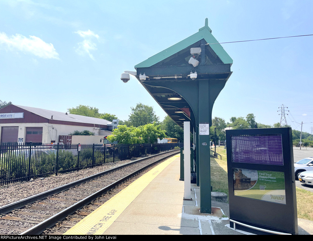 Canopy at the station with the digital board listing the upcoming train times